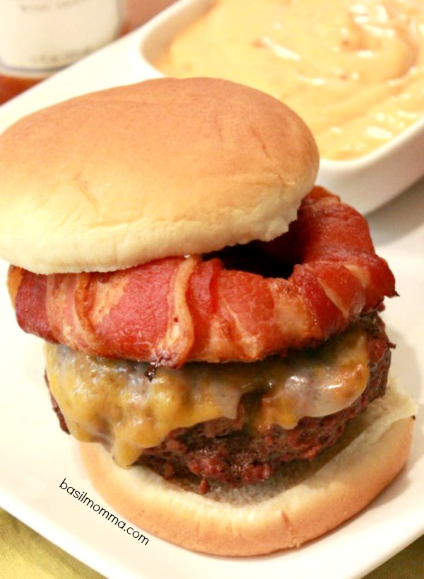 Bacon Wrapped Onion Rings are perfect on top of a juicy burger! Get the recipe on basilmomma.com