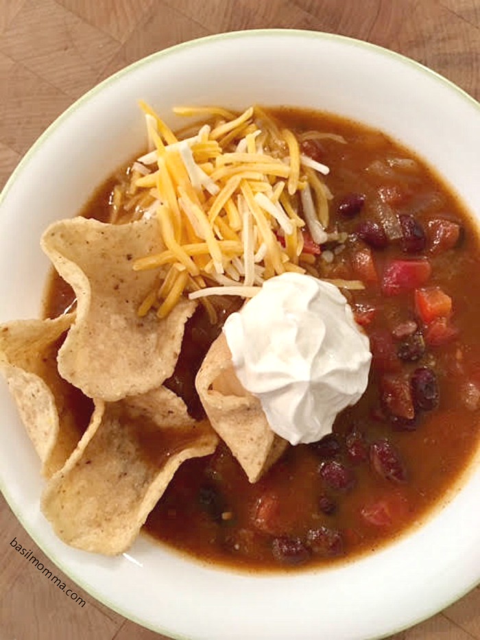 Slow Cooker Black Bean Pumpkin Chili - a hearty, vegetarian chili and the perfect fall comfort food! Recipe on basilmomma.com