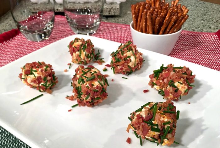 Bacon cheddar cheese ball bites are easy holiday appetizers or game day snacks. Tiny balls of cheddar and cream cheese, rolled in crisp bacon and chives. | Recipe on basilmomma.com