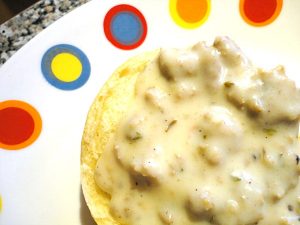 Biscuits with Sausage Gravy - This classic southern recipe is easy to make and perfect for breakfast or brunch. Get the recipe at basilmomma.com