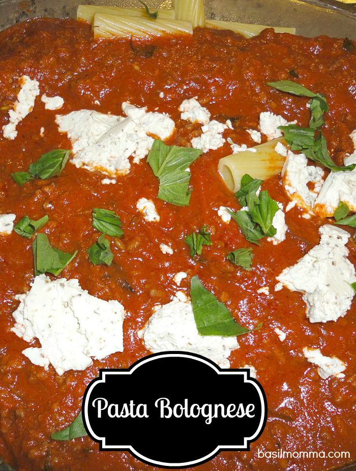 Pasta Bolognese Recipe, from basilmomma.com - This classic Italian dinner has a rich, meaty red sauce served over pasta, then topped with goat's cheese and fresh basil. Easy, inexpensive, and delicious!