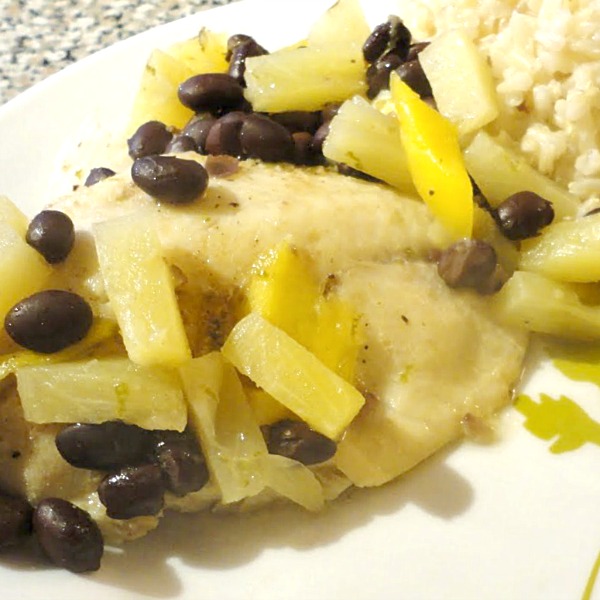 Making dinner for ten dollars to feed a family of four is easier than you think! We made this fruity tilapia with black beans and brown rice. Get the recipe on Basilmomma.com