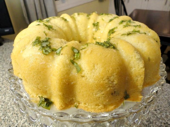 Pound cake with lemon basil glaze is the perfect cake recipe to make for a light, lemony summer dessert. The fresh basil adds great flavor and a nice visual aspect to the sugar glaze on top.