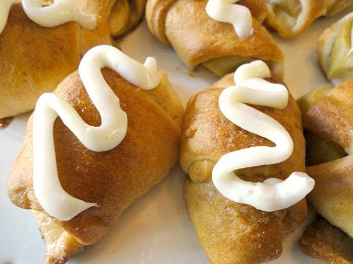 Apple pie fingers are little bite-sized apple pies, drizzled with cream cheese glaze. This apple pie recipe is quick and easy, coming together in minutes, using ready-to-bake pie crust dough!