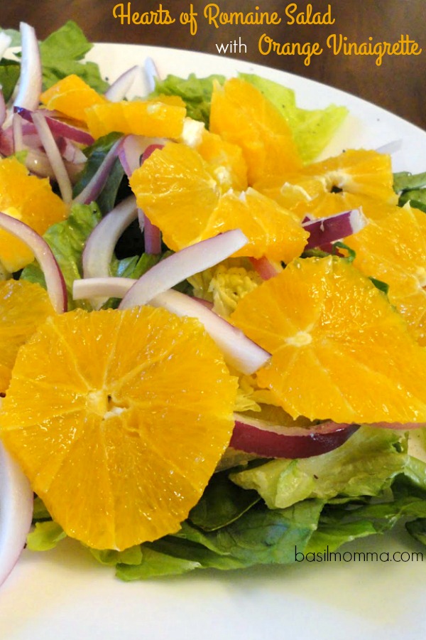 Hearts of Romaine Salad with Orange Vinaigrette - A healthy salad with romaine hearts, oranges, red onion, crunchy walnuts and blue cheese, drizzled with orange vinaigrette. Get the recipe from basilmomma.com