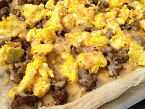 Sausage Breakfast Pizza is topped with fluffy scrambled eggs, Italian sausage, and chipotle cheddar cheese. | basilmomma.com