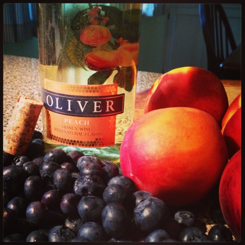 fresh blueberries, ripe peaches, and peach honey wine