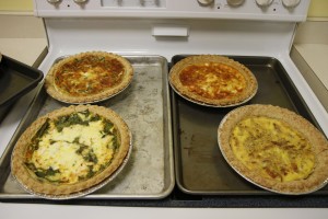 4 delicious quiche recipes: spinach feta, bacon quiche, a ham and cheddar quiche,; egg only quiche, and egg and cheddar, with peppers, onions, and zucchini