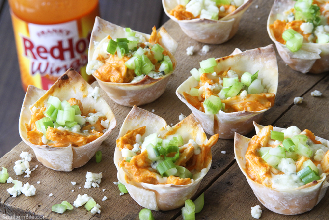 Buffalo Chicken Dip Cups from Southern Bite are one of the easy New Year's Eve appetizers that we love!