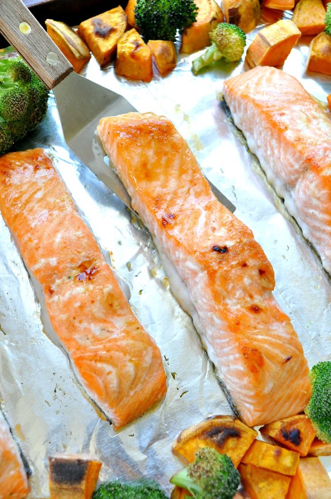Sheet Pan Dinners don't get more delicious than this Maple Glazed Salmon from The Seasoned Mom. Get the recipe in a sheet pan dinners collection on basilmomma.com