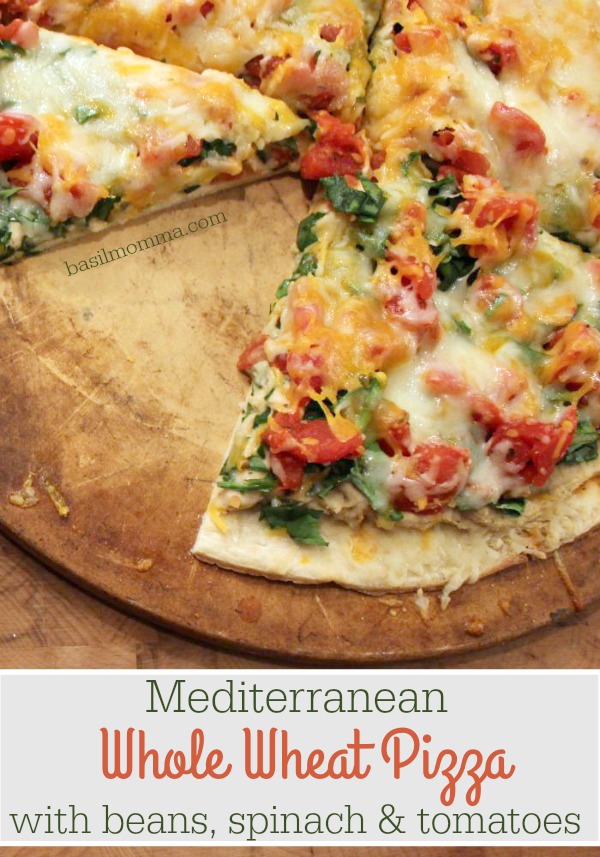 Mediterranean Whole Wheat Pizza with White Beans, Spinach, and Tomatoes - a delicioius meal full of cancer fighting foods! Get the recipe on basilmomma.com