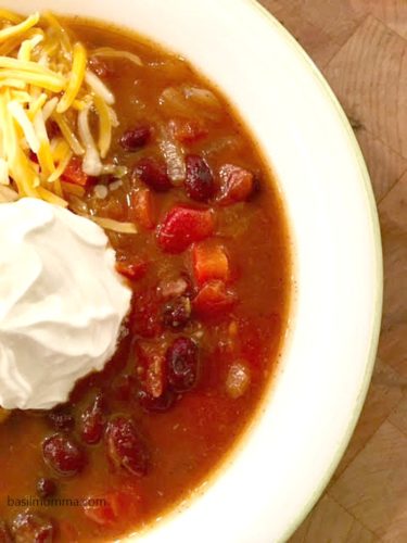 Slow Cooker Black Bean Pumpkin Chili - a hearty, vegetarian chili and the perfect fall comfort food! Recipe on basilmomma.com