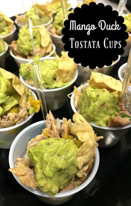 Mango duck mini tostadas are a quick, easy, and flavorful appetizer for any occasion. Fresh mango, shredded duck breast, red onion and spices sit in bite sized corn tortilla cups with fresh guacamole. | Basilmomma.com