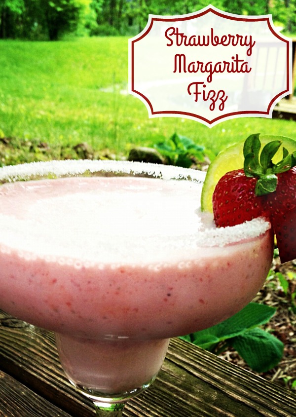 Fizzy Strawberry Margaritas are a simple dessert cocktail or mocktail recipe. Traditional margaritas are given a splash of club soda and a scoop of strawberry ice cream. Recipe on basilmomma.com