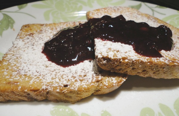 Homemade blueberry maple syrup on cinnamon French toast