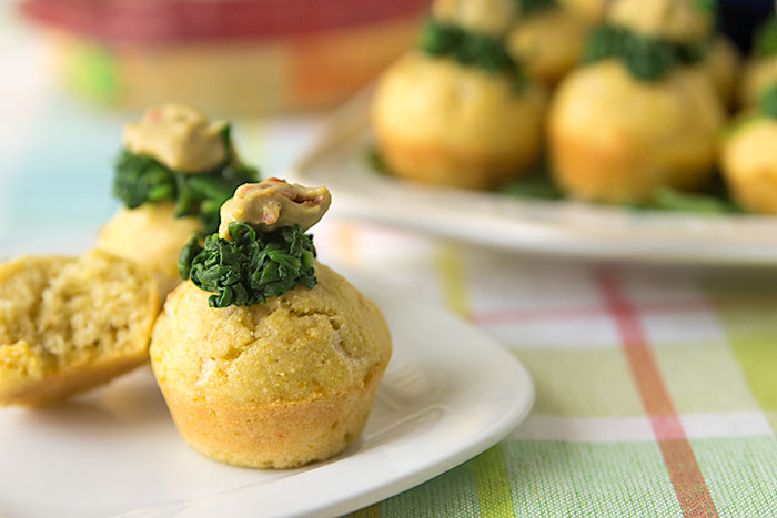 Mini spinach artichoke hummus corn muffins, made with Sabra spinach artichoke hummus, baby spinach. Wholesome REAL FOOD appetizer or healthy snack.
