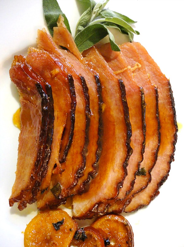 Tangerine glazed ham is an easy holiday ham recipe, perfect to serve for Easter dinner or any Sunday brunch. | Recipe on Basilmomma.com