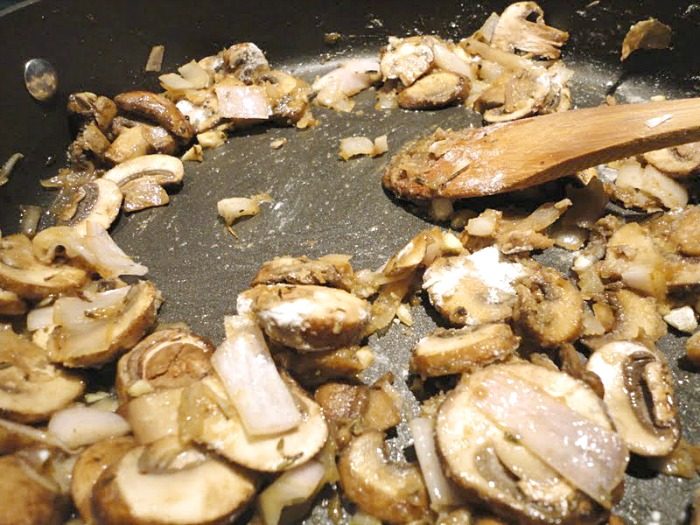 Cooked baby portobello mushrooms and shallots
