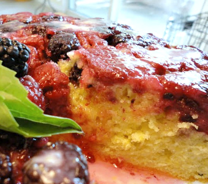 slice of mixed berry upside down cornmeal cake