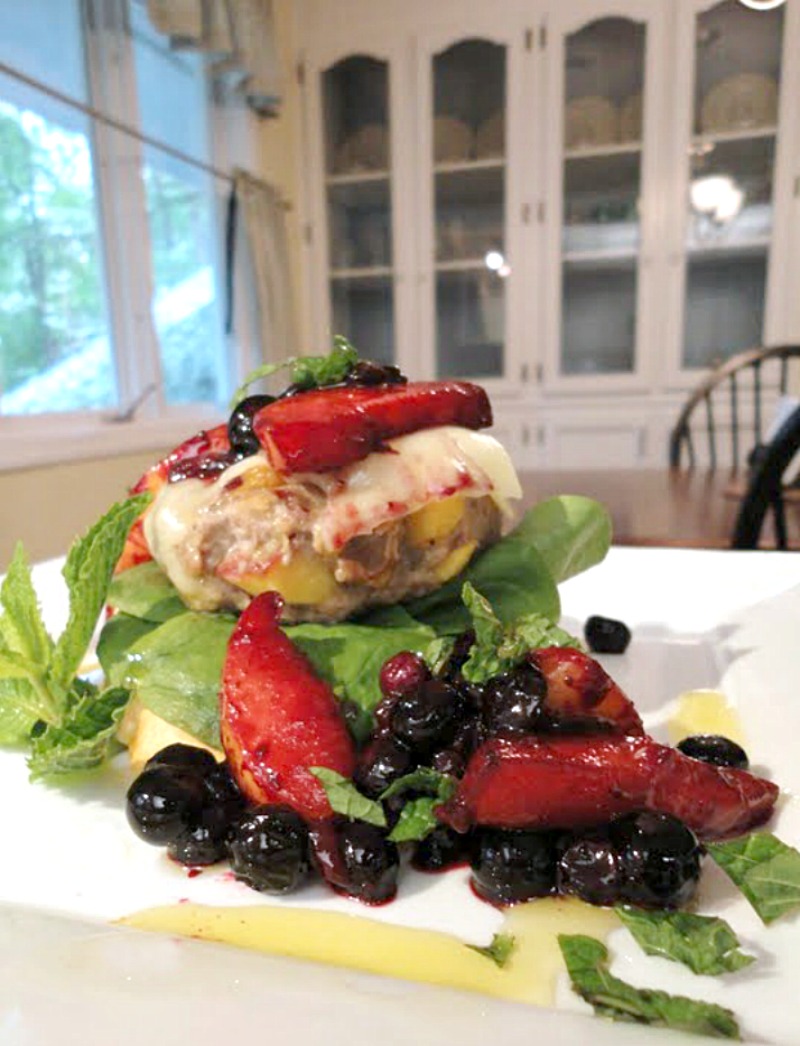 These turkey burgers are stuffed with fresh peaches, grilled, then served on a toasted baguette with fresh greens and a topping of delicious blueberry-peach sauce. Peach stuffed grilled turkey burgers make a flavorful, fresh, healthy dinner recipe.